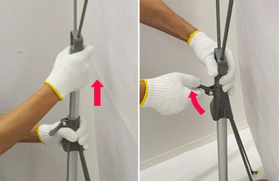 注水式xバナースタンド:6 支柱中心のレバーを引きメディアが張るまでゆっくり上げ、レバーを戻します。